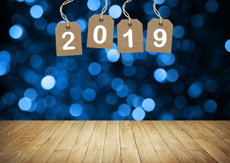 new year number on the blank wood table. New year background
