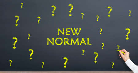 New normal and question mark concept on chalkboard. Normalization process after pandemic