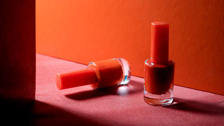 nail polish bottles on red groundの写真素材