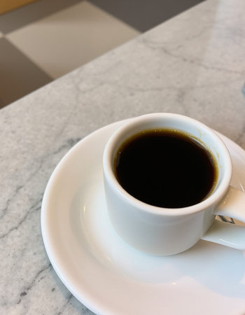 Coffee cup on the table in coffee shop, stock photo