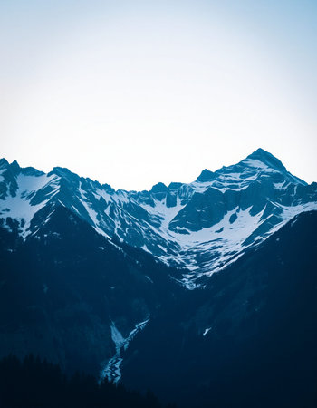 Mountain landscape with snow and clear blue sky. Caucasus Mountains, Georgia.