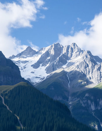 Mountain landscape with snow and clear blue sky.