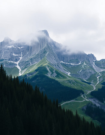Mountain landscape with clouds and fog. Dolomites, Italy