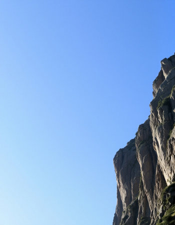 Mountain landscape with clear blue sky, closeup of photo.の写真素材