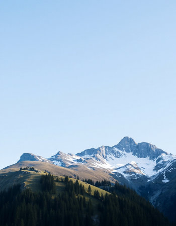 Mountain landscape with snow-capped peaks in the background.の写真素材