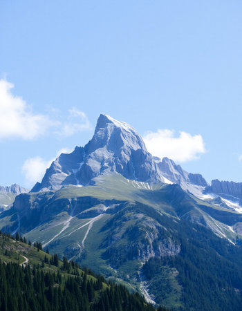 Mountain landscape in summer with blue sky and white clouds, Switzerlandの写真素材