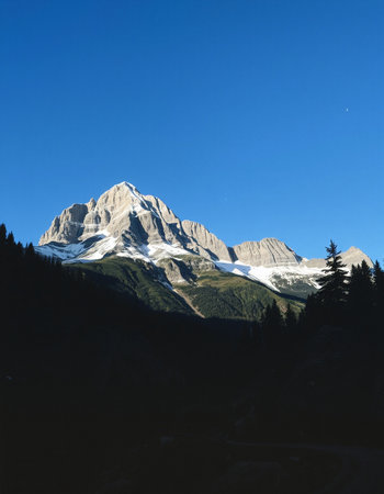 Mountain landscape with clear blue sky and snowcapped peaks.の写真素材