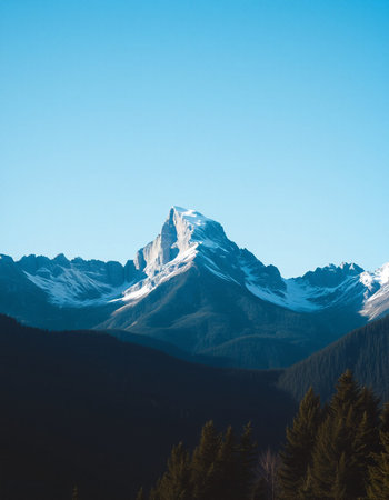 Mountain landscape with clouds and blue sky.