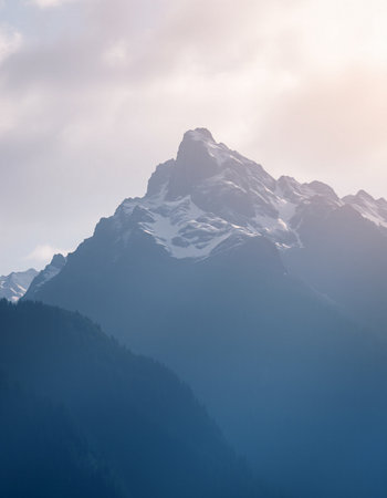 Mountain landscape with snow and fog.の写真素材