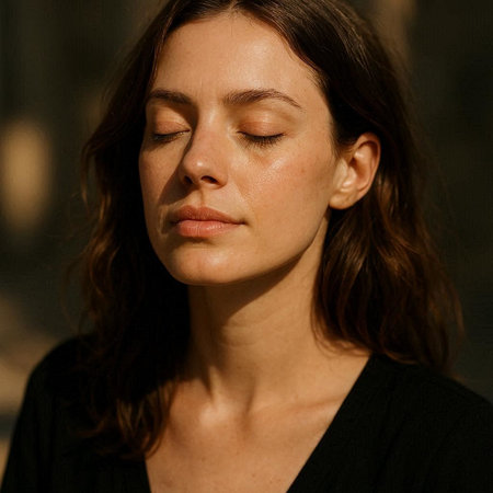 Portrait of a beautiful young brunette woman with closed eyes.