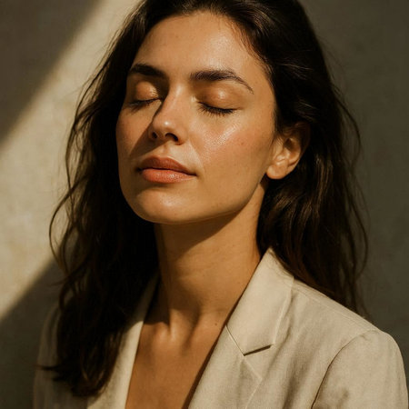 Portrait of a beautiful young brunette woman with closed eyes and closed eyes