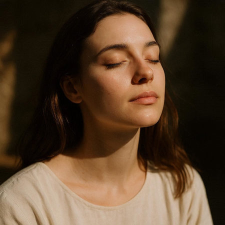 Portrait of a young beautiful woman with closed eyes and closed eyes