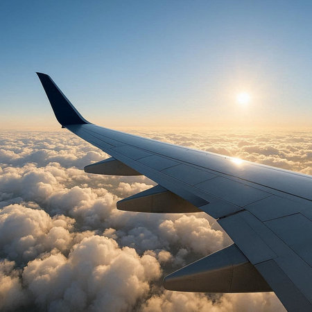 Aerial view of clouds and blue sky with airplane wing. 3d render