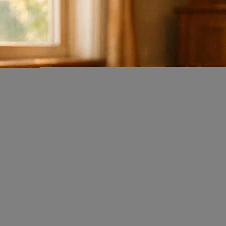 A vertical shot of a blurred background of a room with a window