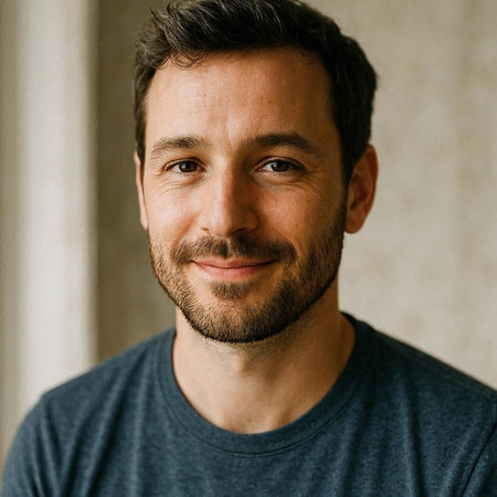 Portrait of a handsome man with a beard in a gray t-shirt