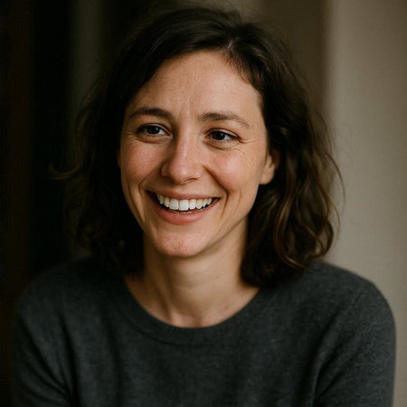Portrait of a smiling woman in a gray sweater. Close-up.