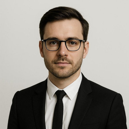 Businessman in black suit and eyeglasses looking at the camera