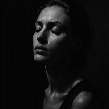 Black and white portrait of a young beautiful woman with closed eyes.の写真素材