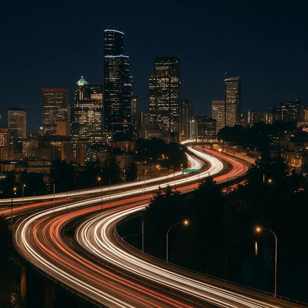 Chicago skyline at night with car light trails on the street, USA.の写真素材