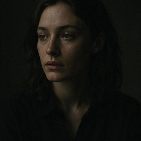 Portrait of a beautiful brunette woman in a dark room.
