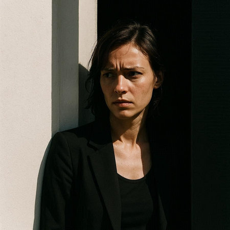 Portrait of a beautiful woman with dark hair in a black coat