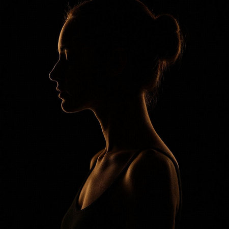 Silhouette of a beautiful young woman on a black background.