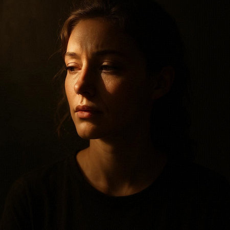 Portrait of a beautiful young woman looking at the camera on a dark background
