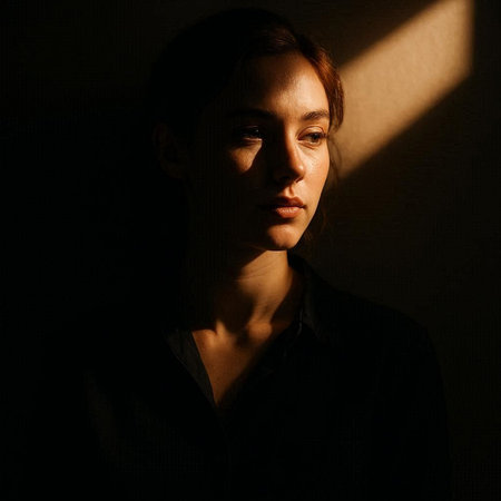 Portrait of a beautiful young woman with shadow on her face.