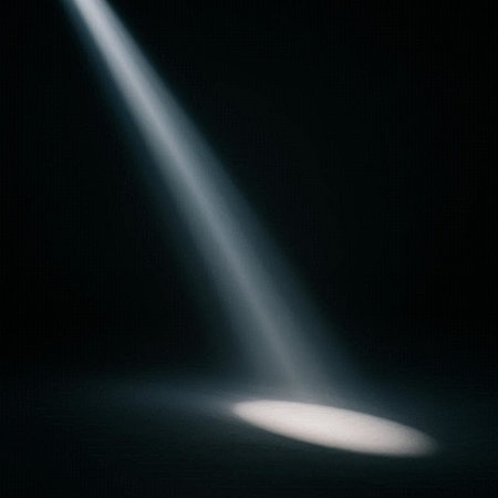 Illustration of a spotlight on a dark background with a beam of light