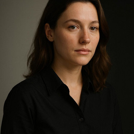 Portrait of a beautiful woman in a black shirt on a dark background