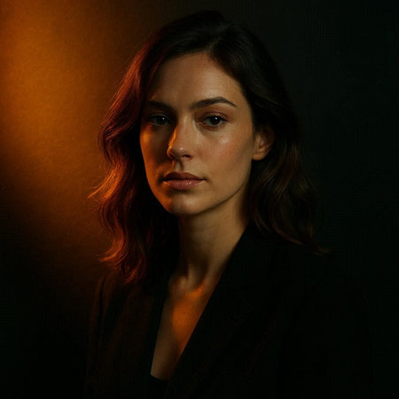Portrait of a beautiful woman in a black jacket on a dark background