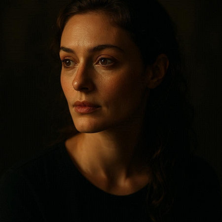 Portrait of a beautiful brunette woman in a black dress.
