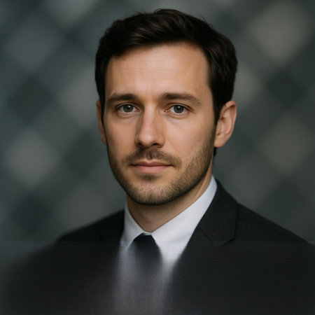 Portrait of a handsome young businessman looking at the camera with a serious expression