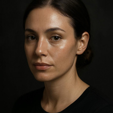 Portrait of a young woman on a black background. Studio shot.