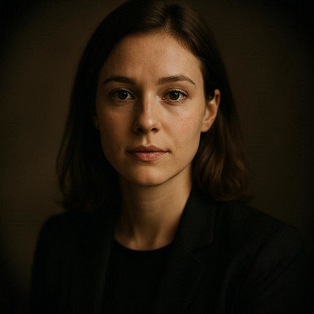 Portrait of a beautiful young woman in a black jacket on a dark background