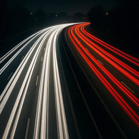 Car light trails on the road at night. Long exposure photo.