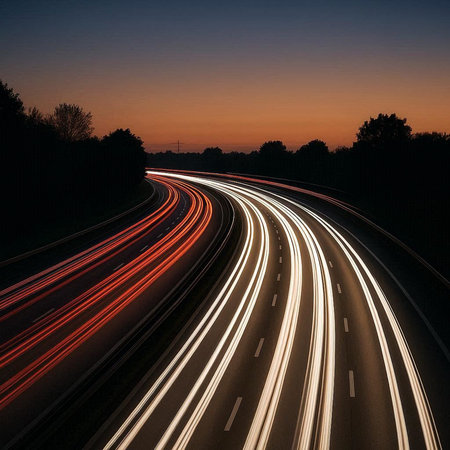 Car light trails on the road at night. Long exposure photo.