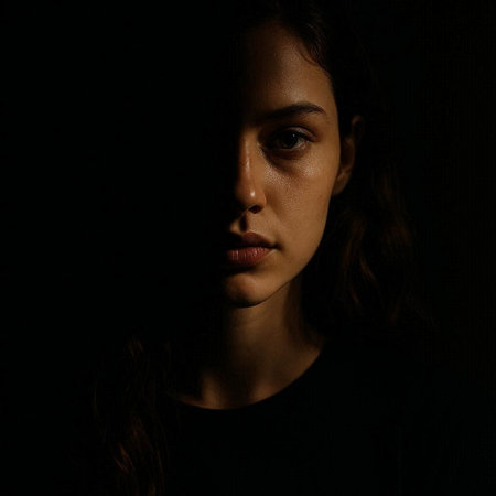 Portrait of a young woman on a black background. Studio shot.