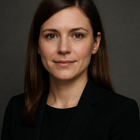 Portrait of a businesswoman in a black suit on a dark background