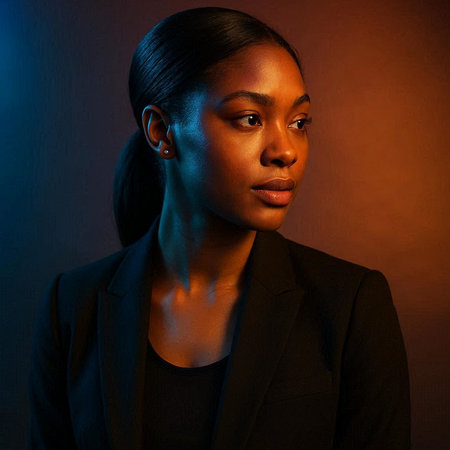 Portrait of a young African American woman in a black suit.