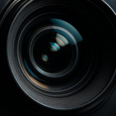 Close-up photo of a camera lens. Shallow depth of field.