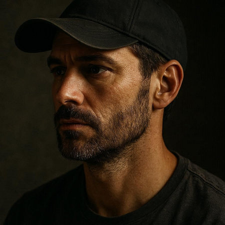 Portrait of a man with a baseball cap. Studio shot.
