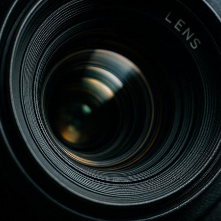 close up of a camera lens with focus on the word lens.