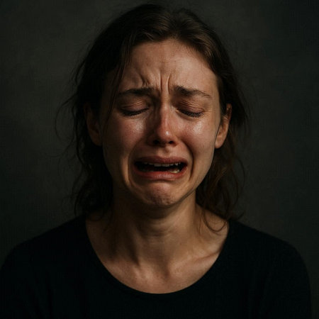 Portrait of a crying woman on a dark background. Studio shot.の写真素材