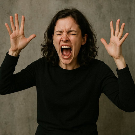 Portrait of a young woman in a black T-shirt screaming and gesturing