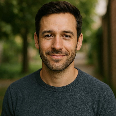Portrait of a handsome young man with a beard in a park