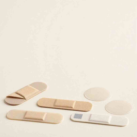 Medical bandage on a white background. Photo in old color image style