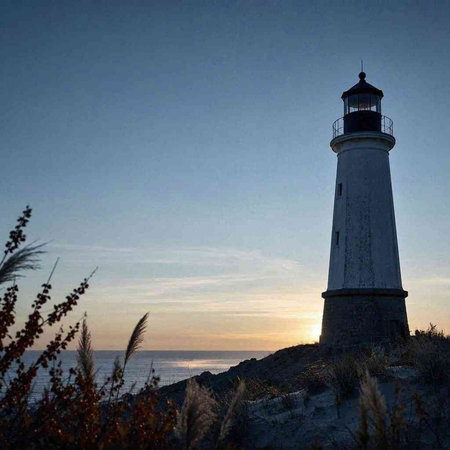 Lighthouse at sunset on the coast of the Baltic Sea in Poland