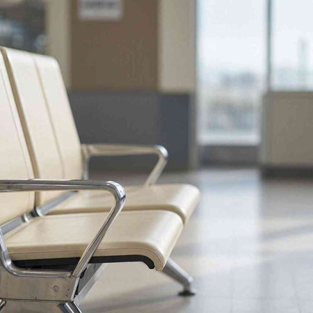 Empty chairs in the lobby of the airport. Blurred background.