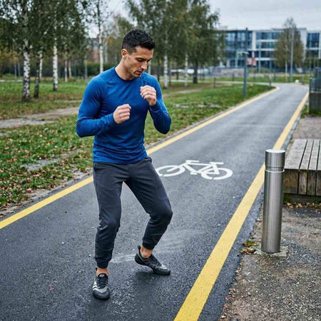 Athletic man jogging in the park. Healthy lifestyle.